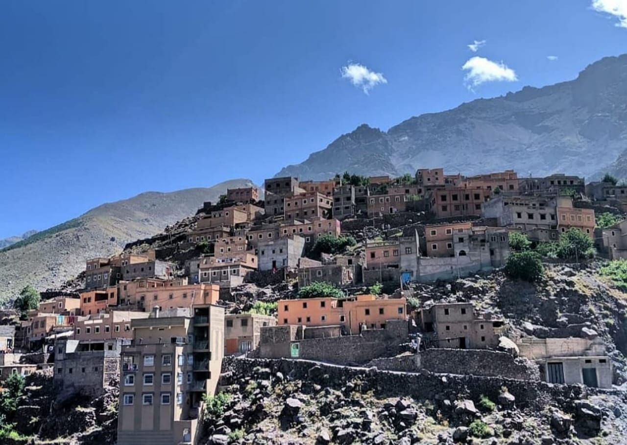 The Berber village of Imlil built into the hillside below the Toubkal massif